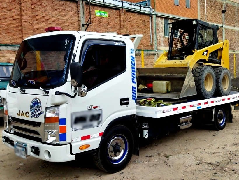 A little boy laughing while reading the Holy Bible